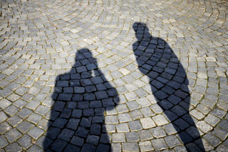 Shadows of two people on the ground.